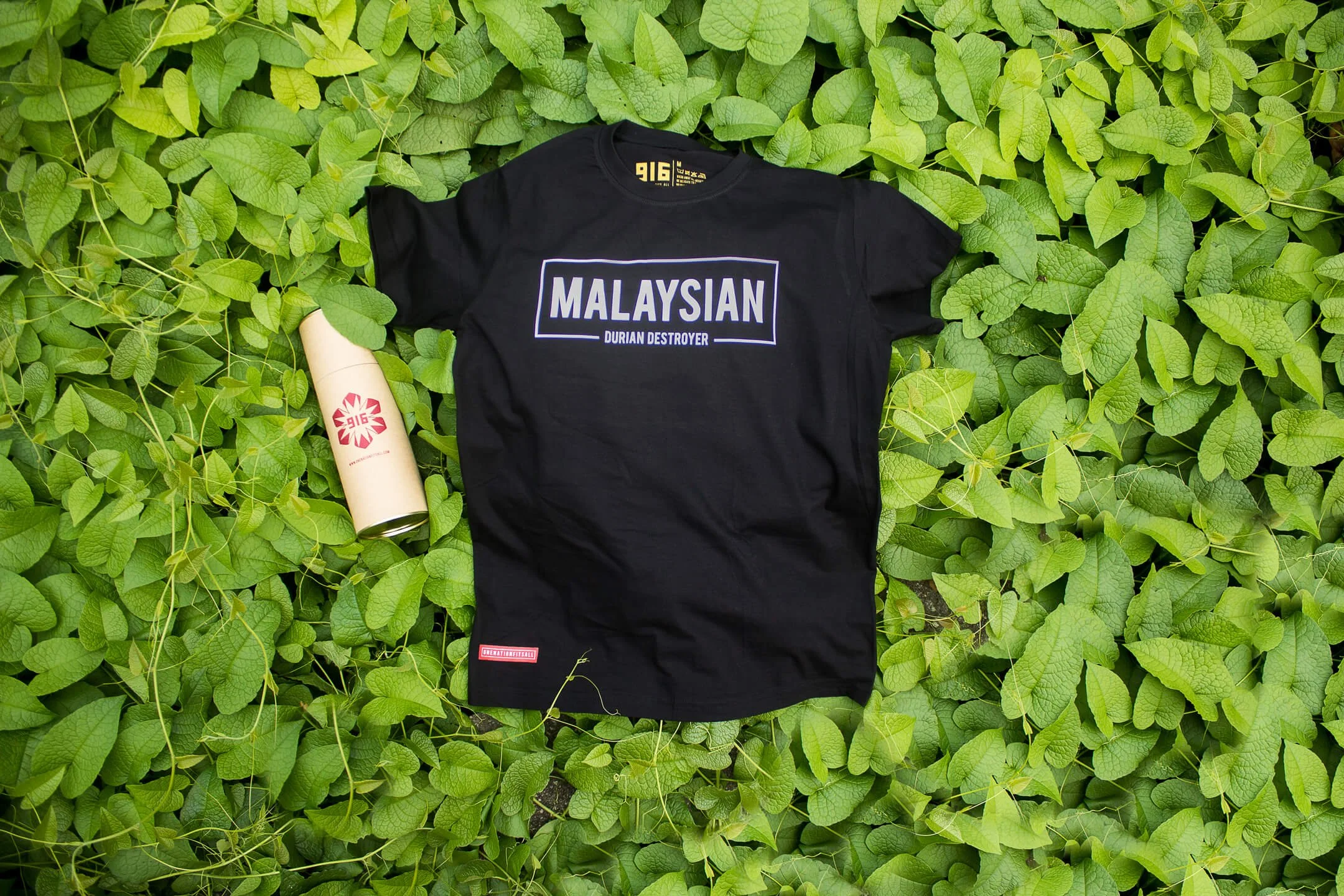 916 Apparel branding and packaging photographed against green pastures