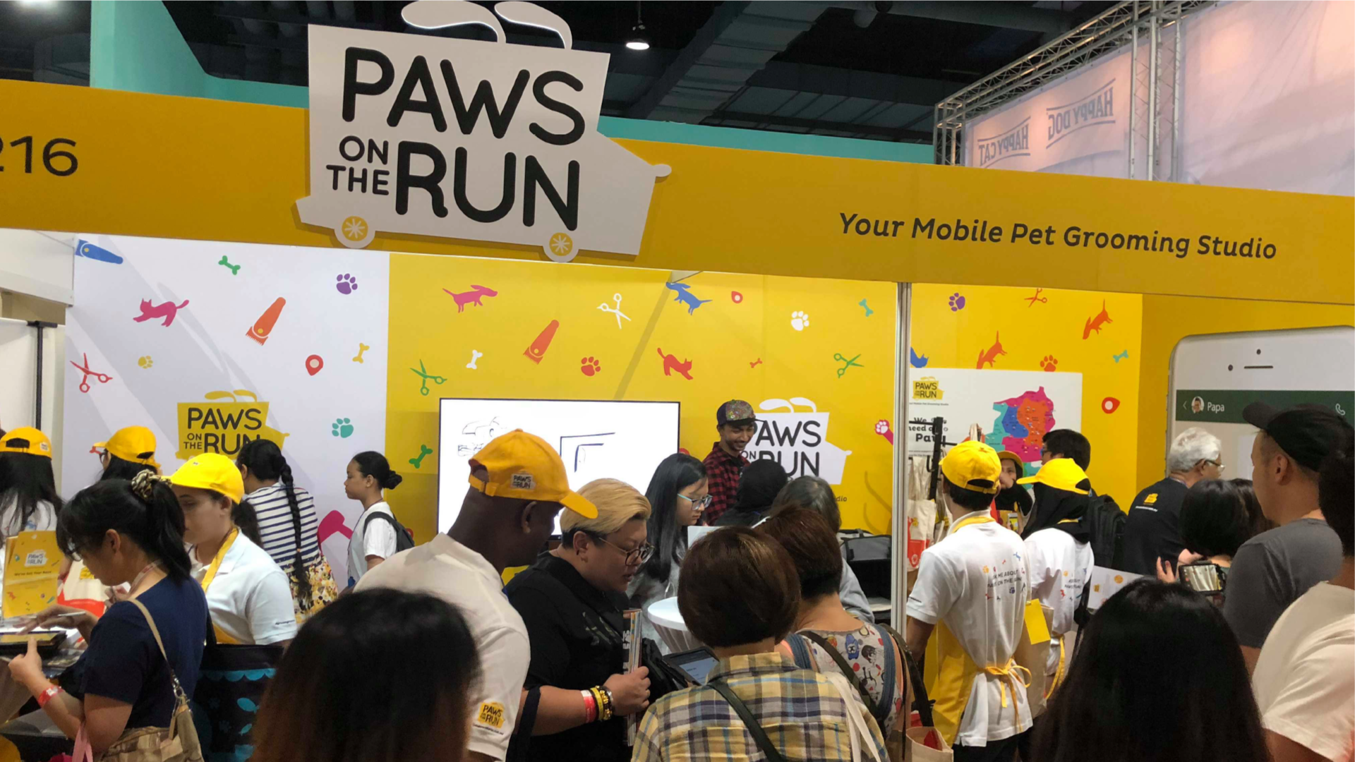A photograph of a crowded Paws On The Run booth at Mid Valley Megamall