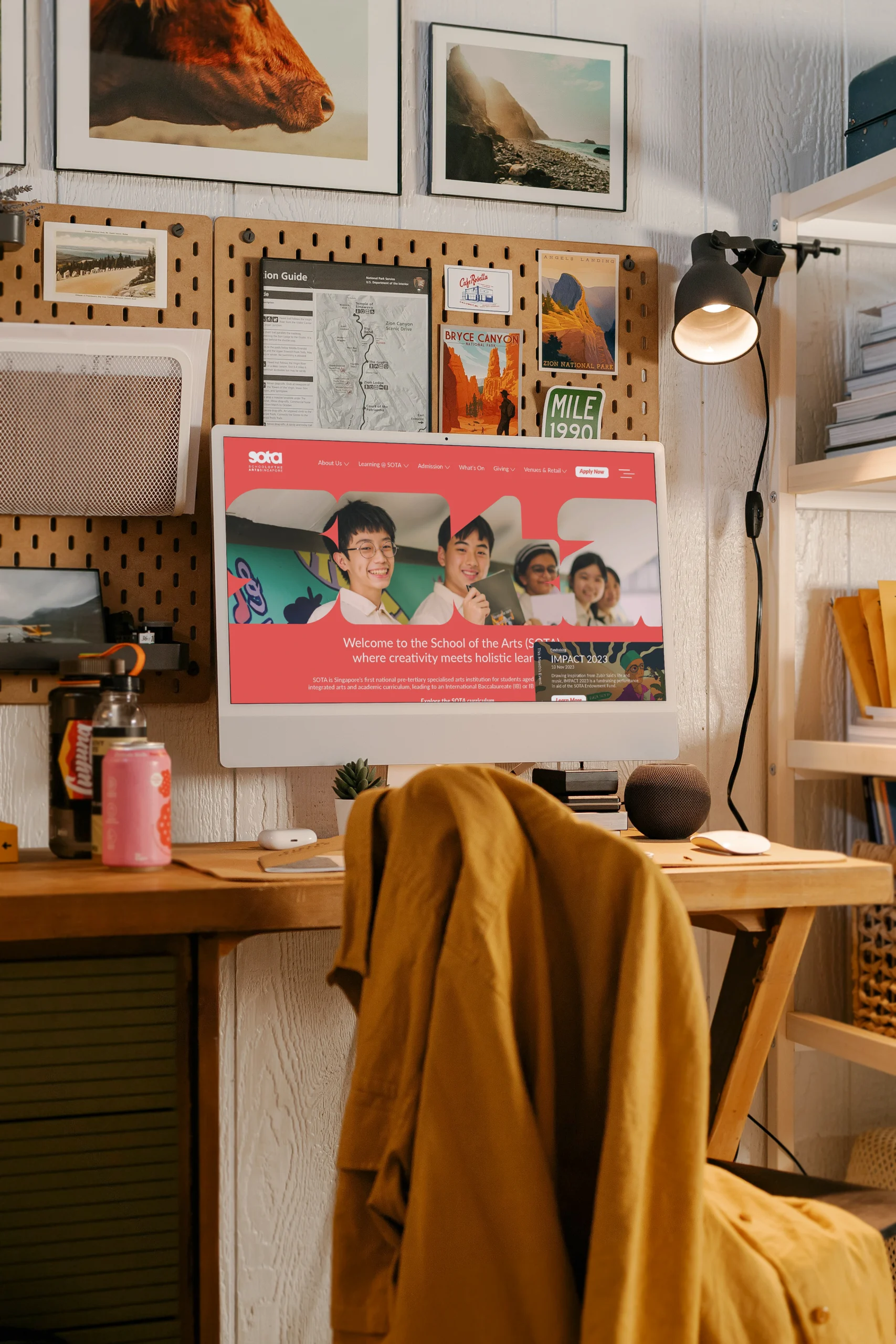 School of The Arts, Singapore — homepage mockup on an iMac sitting on a creative workstation